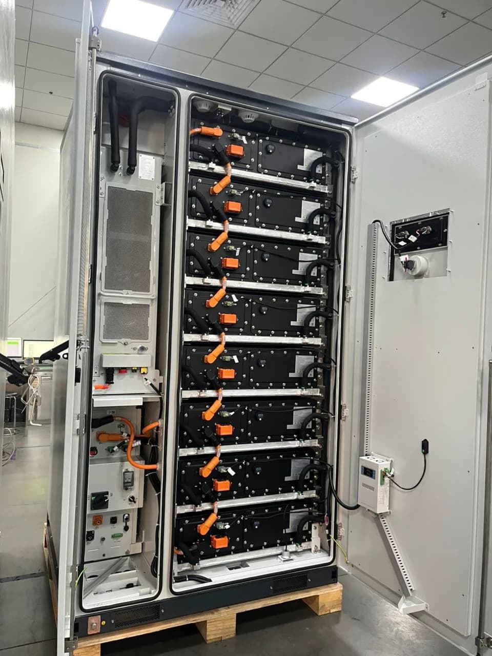 Rows of battery modules installed inside an energy storage cabinet.