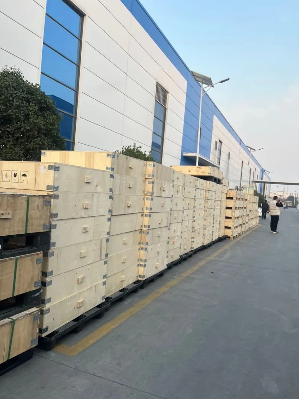 Great Power battery energy storage equipment positioned outside a manufacturing facility.