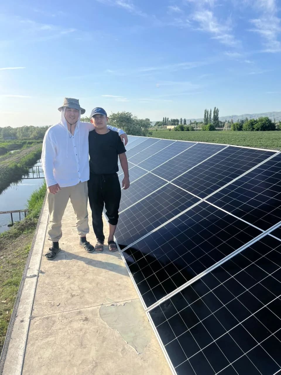 Project partners visiting a rooftop solar installation.